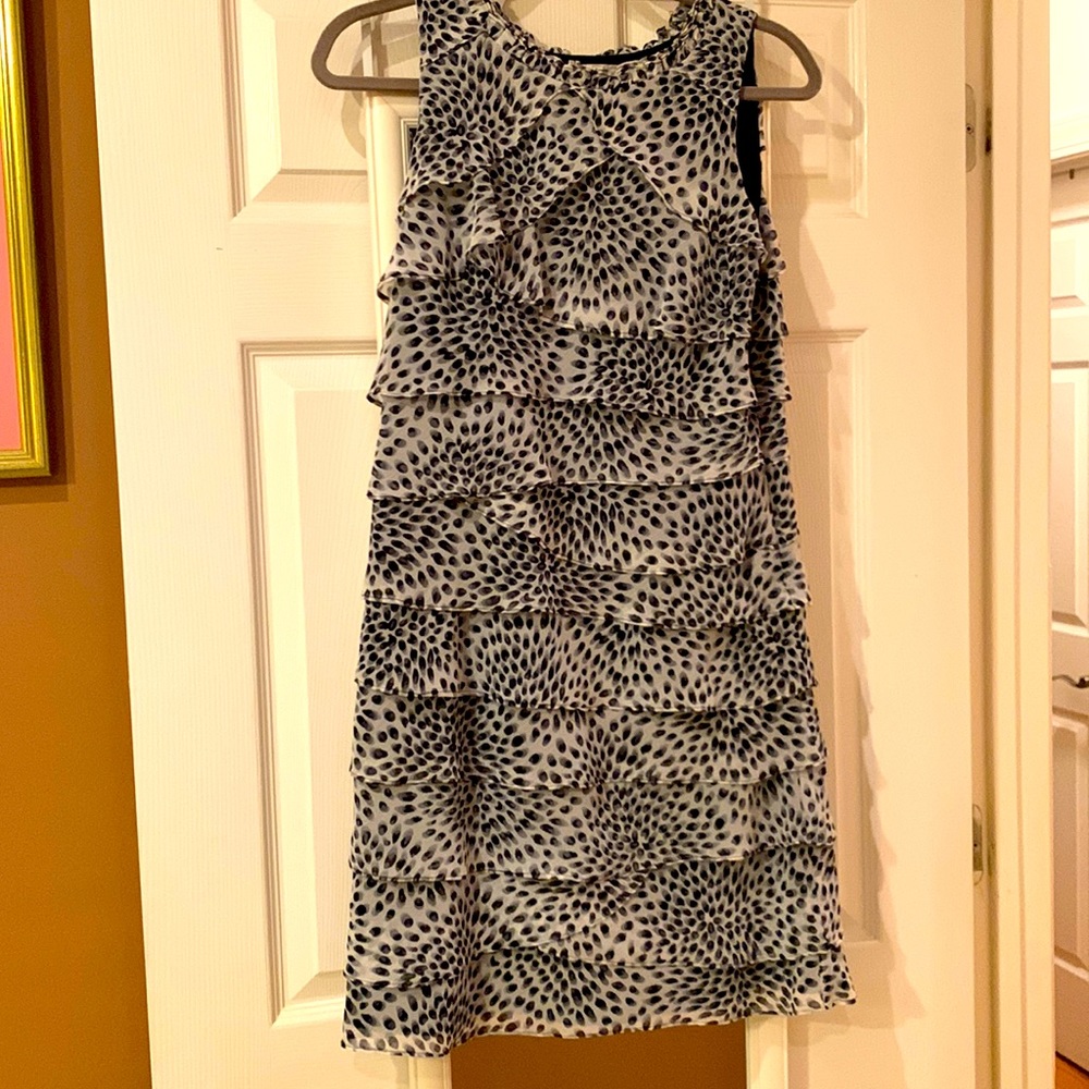 Lined white layered dress/blck all-over print. Not worn,no tags. Hidden side zip